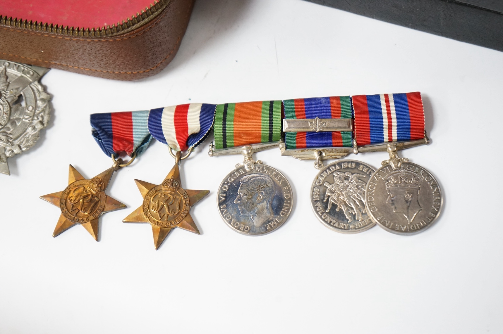A WWII Canadian medal group awarded to E.B. Ash, a member of the Toronto Scottish Regiment, comprising of the 1939-1945 Star, the France and Germany Star, the Defence Medal, the 1939-1945 Canada Voluntary Service Medal w